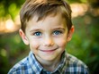 © kansak01 - A charming portrait of a young boy with sparkling eyes and a joyful smile, captured in a beautifully