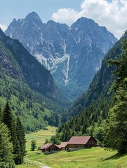 Wall Mural - Two rustic wooden cabins nestled in a valley, surrounded by lush green meadows and towering mountains.