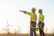 © Kawee - Diverse ethnicity male technicians working in the wind turbines field.