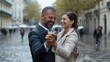© AnuStudio - Couple dancing joyfully in the rain on a city street, expressing love and happiness.