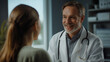 © Andres Mejia - Friendly doctor smiling and talking with patient in a medical consultation