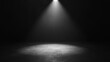 © adri - A single spotlight illuminates a dark room with concrete floor.