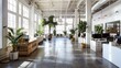 © improvee design - Modern office interior featuring large windows, minimalist furniture, and lush plants. The open plan layout creates a collaborative and inspiring work environment.