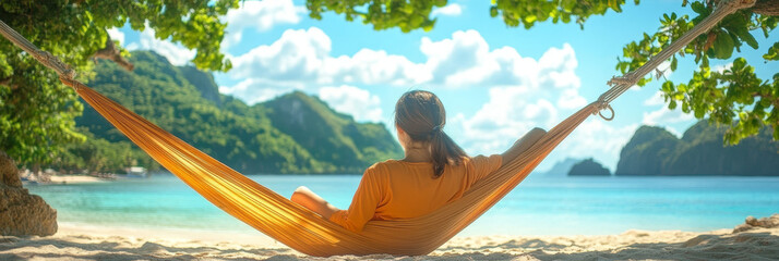 Wall Mural - Woman relaxing in a hammock on a tropical beach.