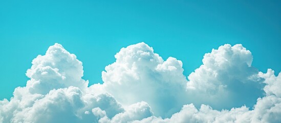 White Fluffy Clouds Against a Vibrant Blue Sky