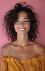 Wall Mural - A woman with brown hair and a yellow dress is smiling. She has a green eye and a red nose