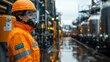 © danielkosh - Female engineer in protective workwear and gas mask standing at chemical plant