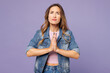 © ViDi Studio - Young woman wear denim jacket violet top casual clothes hold hands folded in prayer gesture, begging about something isolated on plain pastel light purple background studio portrait Lifestyle concept