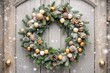 © Юлия Клюева - Happy New Year 2025. A Christmas wreath on the front door. Home decor for the New Year. The concept of celebration and festive decoration of a cozy home.