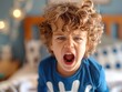© Natalia - A young boy with curly hair screams with his mouth open. AI.
