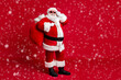 © deagreez - Full length photo of retired old man grey beard hold glasses bear sack presents good children wear santa costume gloves coat belt sunglass headwear black boots isolated red color background