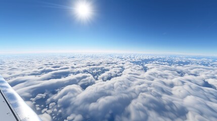 Canvas Print - Plane View Over Clouds and Ocean Beneath Bright Sun