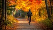 © Witch - Cyclist Riding Through a Fall Foliage Path