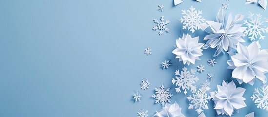 Canvas Print - Lovely paper snowflakes set against a blue background. Copy space image. Place for adding text and design