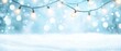 © Albert - A dozen light bulbs dangle from a wire against a backdrop of falling snowflakes and a snow-covered ground