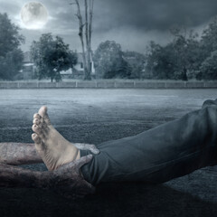 Poster - A zombie hand with a bloody wound grabs a human leg with full moon background. Scene has dark and scary. Zombie, devil, evil, satan, or monster hands