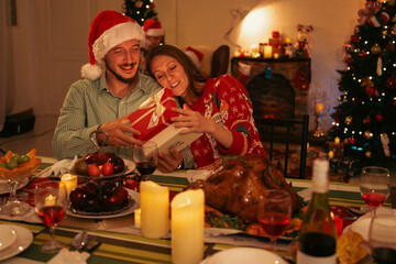 Happy Christmas Eve Celebration, Family Gathers Together at Home to Share Joy and Gifts, Children Excitedly Unwrapping Presents with Decorated Tree, Creating Merry Memories in Warm Winter Atmosphere