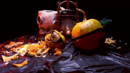 Wall Mural - time-lapse video art scary Halloween pumpkins and an old kerosene lamp in a red light preparation for the celebration in a dark room