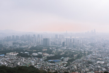 Wall Mural - Aerial panorama sunset view of Seoul, Korea from Namsam Mountain on a moody day