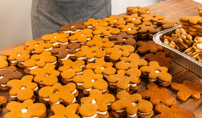 Poster - Making Festive Gingerbread Sandwiches on Rustic Wooden Table