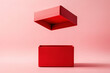 © Alexandra - Red open gift box is floating over an empty box on a pink background