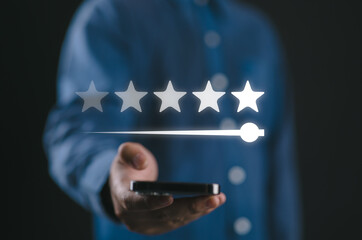 Client holding smartphone to review feedback to give five stars rating for customer evaluation and best excellent after use product and service concept.