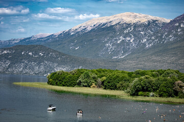 tourists on Lake Ohrid, enjoying nautical activities or cooling off in a beautiful landscape.