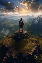 Wall Mural - Photo of a backpacker on the top of the mountain.