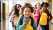 © Iona - A group of cheerful young children with yellow backpacks walk down a bright school hallway, exuding joy and enthusiasm.