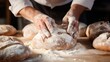© Iona - A close-up of hands dusting flour over freshly baked bread, capturing the essence of craftsmanship and homely baking.