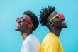 © Nico - Happy Young Men Smiling Against a Blue Background