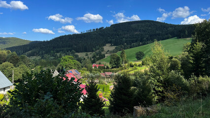 Panoramic view of a mountain village with houses in a mountain Polish valley. Bielice