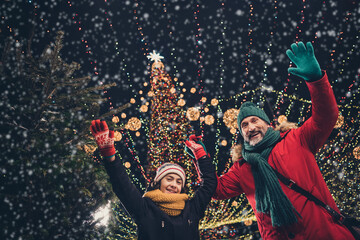 Poster - Photo of handsome pretty school boy husband waving arms palms walking x-mas park outside urban city market