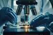 © Fotograf - A person examines a sample under a microscope