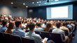 © Daniel - Business people or students are watching a presentation or attend a training or seminar in a lecture hall or auditorium. Conference hall full of people participating in the business training