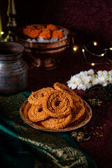 crunchy, spiral-shaped, savory snack from India made from rice and lentil flour and indian spices