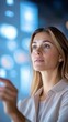 © Jiraphiphat - Businesswoman explaining a business plan to her team, using a large screen in a conference room
