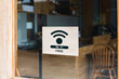 © bancha - Free Wifi sign at the front entrance of the coffee shop to serve customers