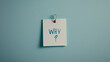 © deimos.az - Word WHY on a sticker attached to an office wall