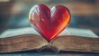 © Nathan - A glowing red heart rests atop an open vintage book, symbolizing love, knowledge, and connection.