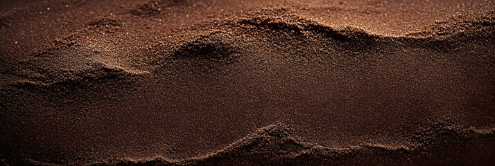 Dark chocolate brown sugar-like grainy texture background