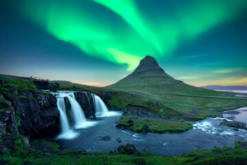 Wall Mural - aurora borealis northern lights over kirkjufellsfoss waterfall. amazing night scene near kirkjufell 