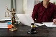 © NanSan - A male lawyer is working at his desk on an online judicial review, focusing on justice, fairness, and legal compliance.He reviews cases, contracts, and legal matters based on general law principles
