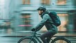 © GreenMOM - A cyclist rides through a rainy cityscape, showcasing urban mobility and adventure in wet weather conditions.
