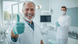 © Tania - Satisfied European patient with a perfect smile in a dentist's chair, gesturing approval with a thumbs-up as the dentist stands nearby, emphasizing positive dental care experience.