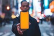 © CogniLens - App demo asian man in his 40s holding an smartphone with a fully orange screen