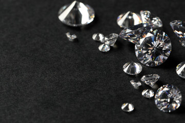 Canvas Print - Many beautiful shiny diamonds on black table, closeup. Space for text