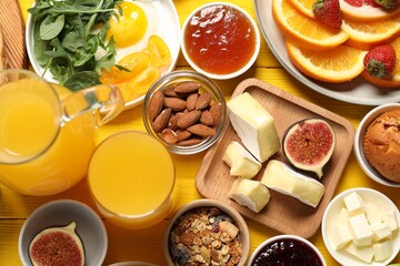 Poster - Different tasty food served for brunch on yellow wooden table, flat lay