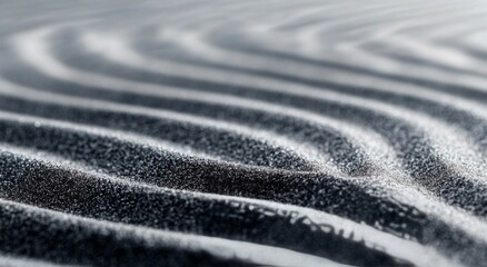 Canvas Print - Abstract patterns of black and white sand at a beach during sunrise