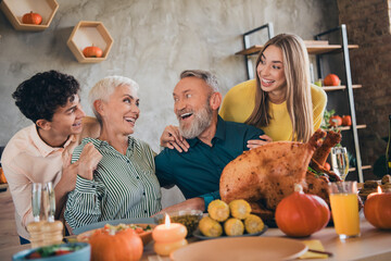 Poster - Photo of four friendly family members cuddle communicate celebrate thanksgiving dinner apartment indoors